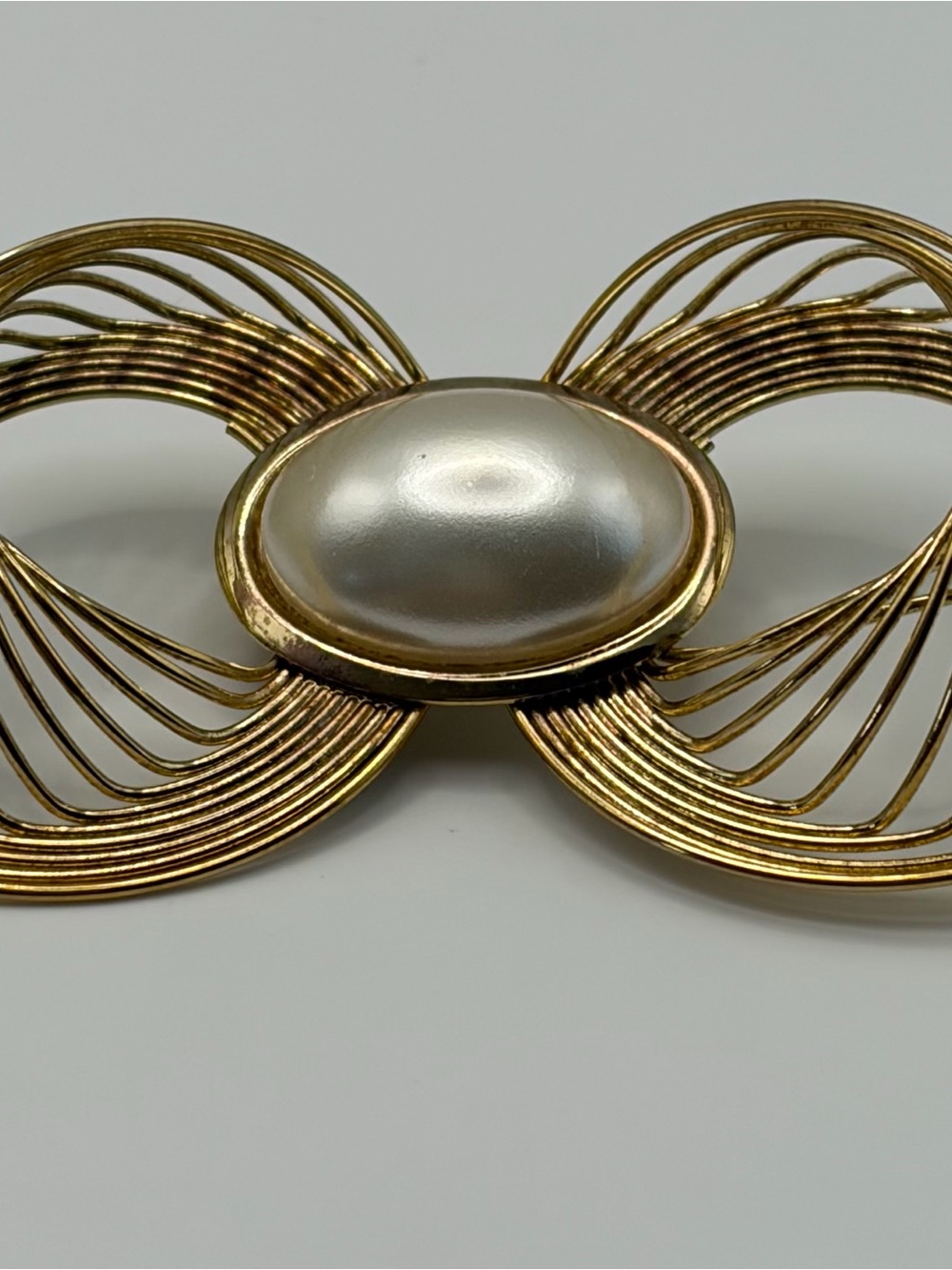 Gold-Tone Bow Brooch with Pearl Center